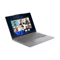 Grey Lenovo ThinkBook 14 2-in-1 laptop open with video call on touchscreen display.