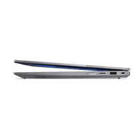 Slim grey Lenovo ThinkBook 14 2-in-1 laptop partially open showing side ports and hinge design.